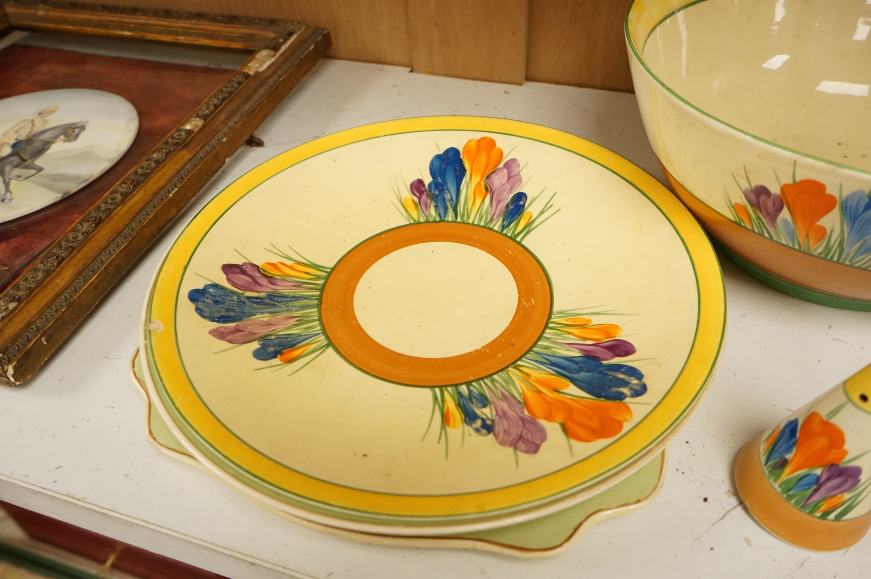 Collection of Clarice Cliff crocus pattern tea wares to include trios, milk jug, and a bowl, largest 22cm in diameter